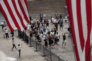 Crowd of On staff run to New York stock exchange 