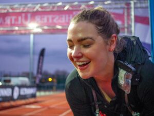 Female ultra runner at the finish line